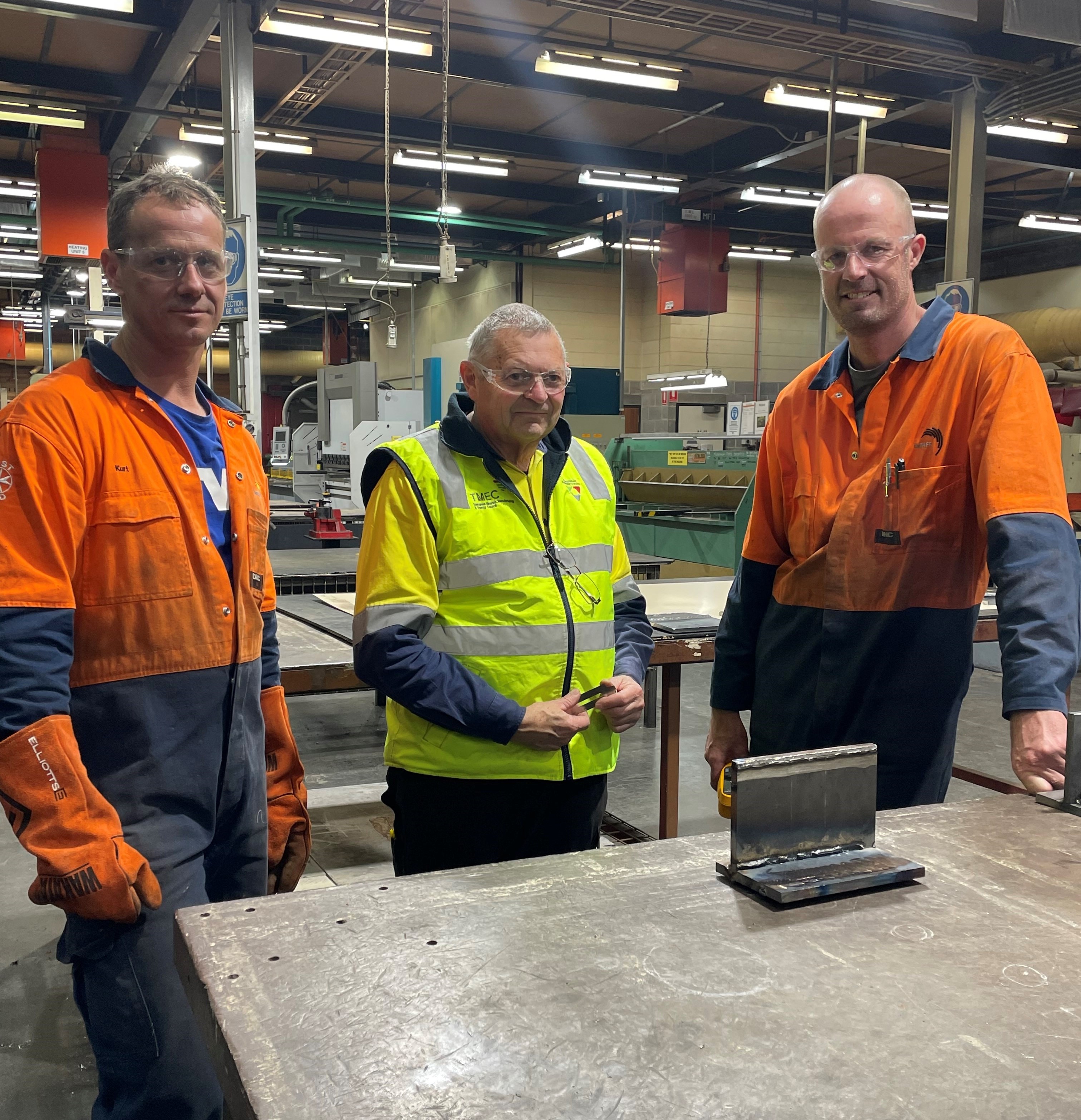 Kurt Sushames, Ray Woods (TMEC Program Facilitator), Rick Timmerman in the metals workshop