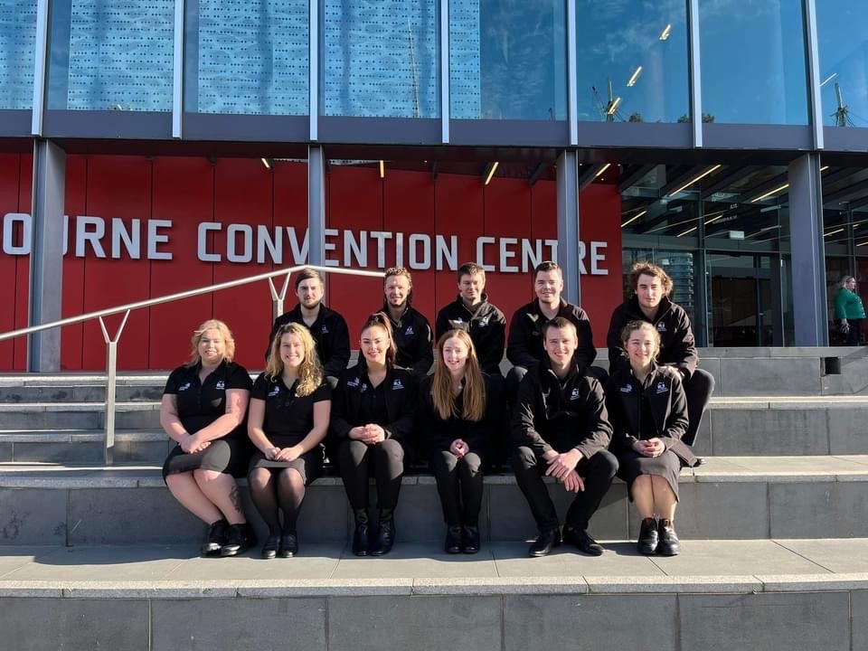 WorldSkills team pose for a photo in front of the Melbourne Convention Centre