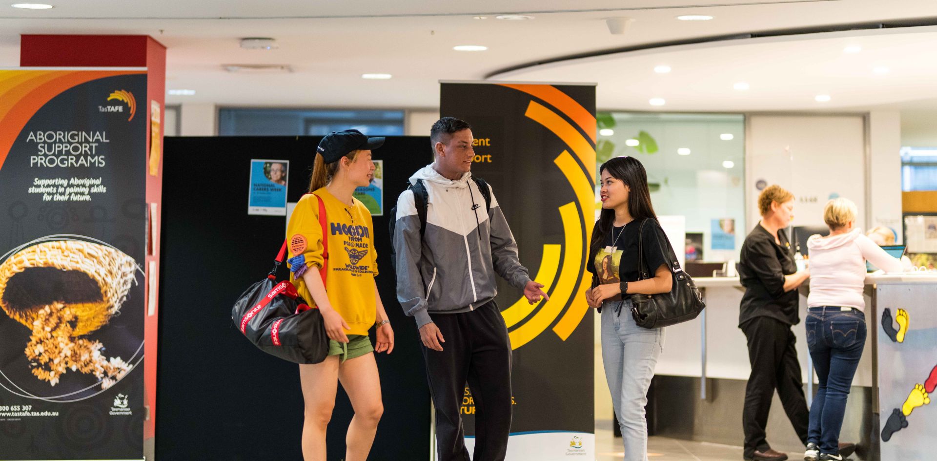 3 international students standing talking in the TasTAFE Building