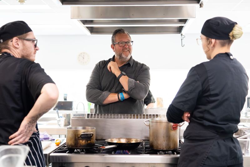 Chef Paul Foreman listens to the career aspirations of TasTAFE cookery learners.