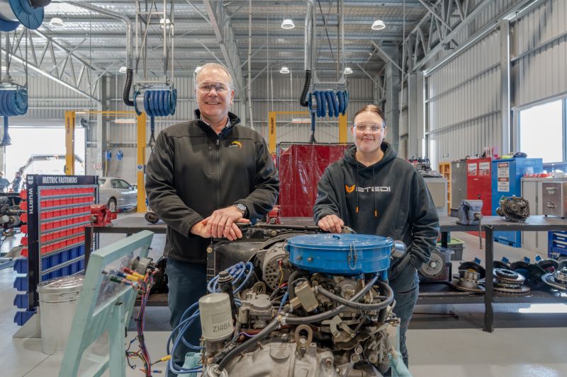 TasTAFE Executive Director Education Operations Brendan Holland on left with third year automotive apprentice Izzy Clark on the right in the Cambridge Automotive Training Facility