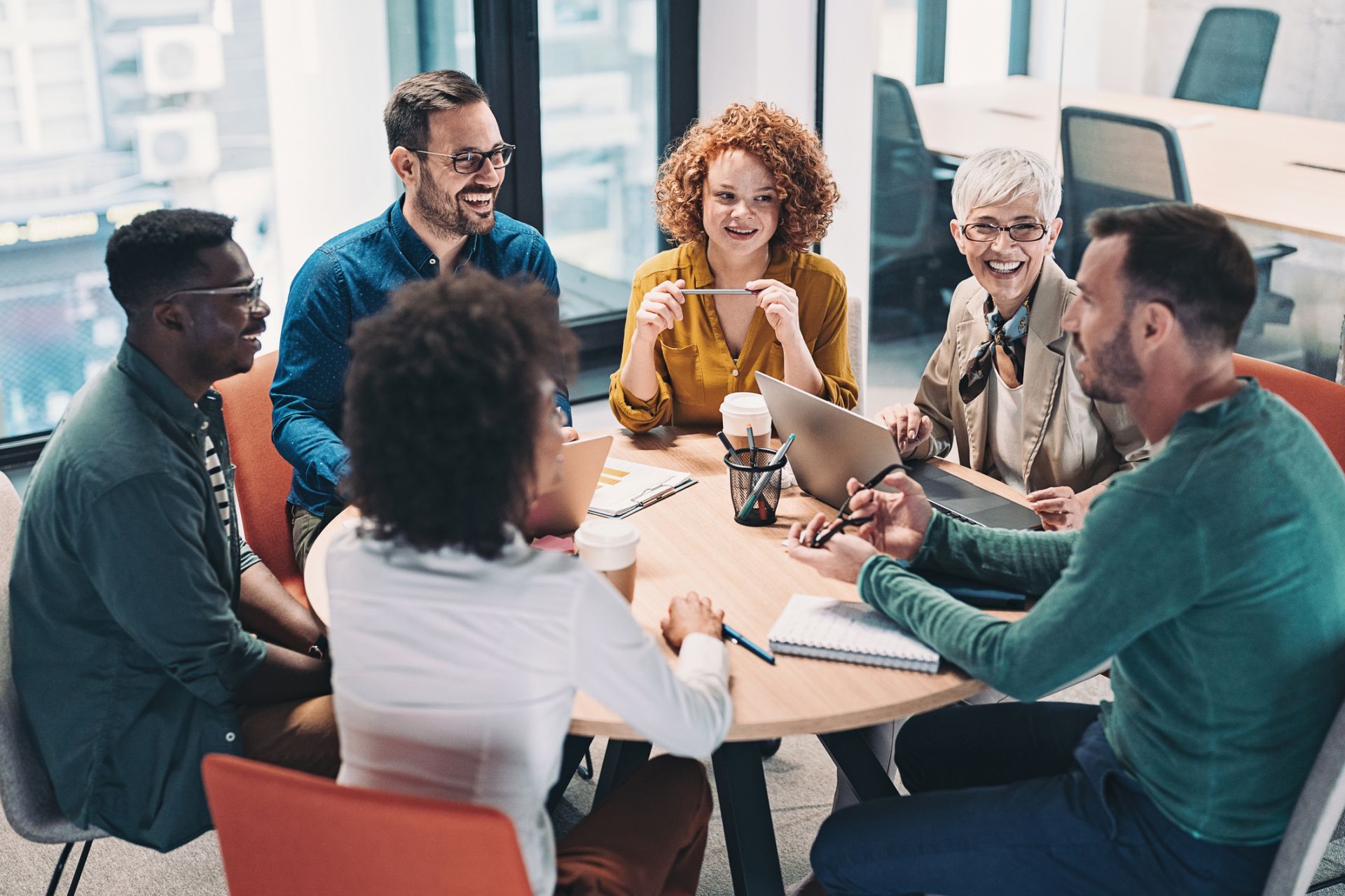 Group of people sitting around a table