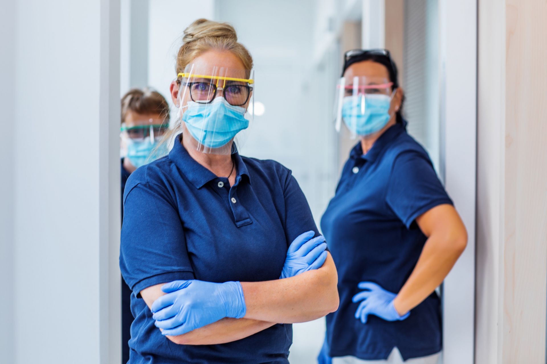 Medical workers in PPE weraing face masks 