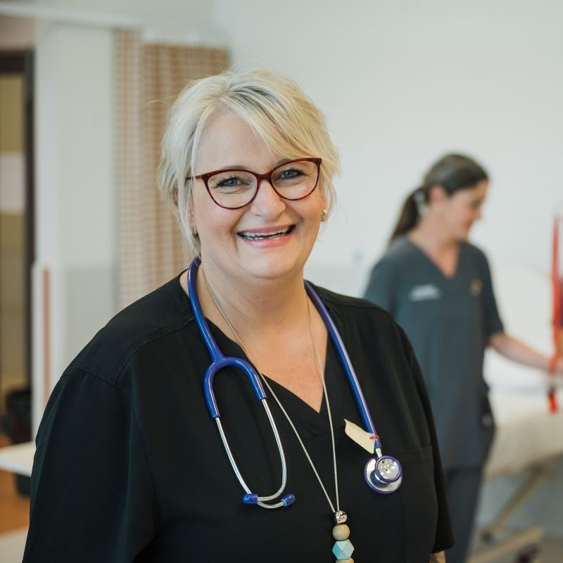 TasTAFE Nursing teacher poses for a photo in the classroom