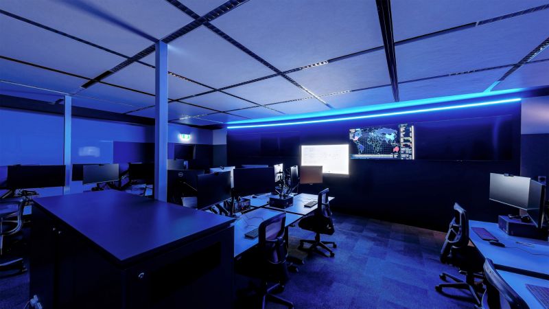 Computer lab with Blue LED lighting and tv screens on the wall