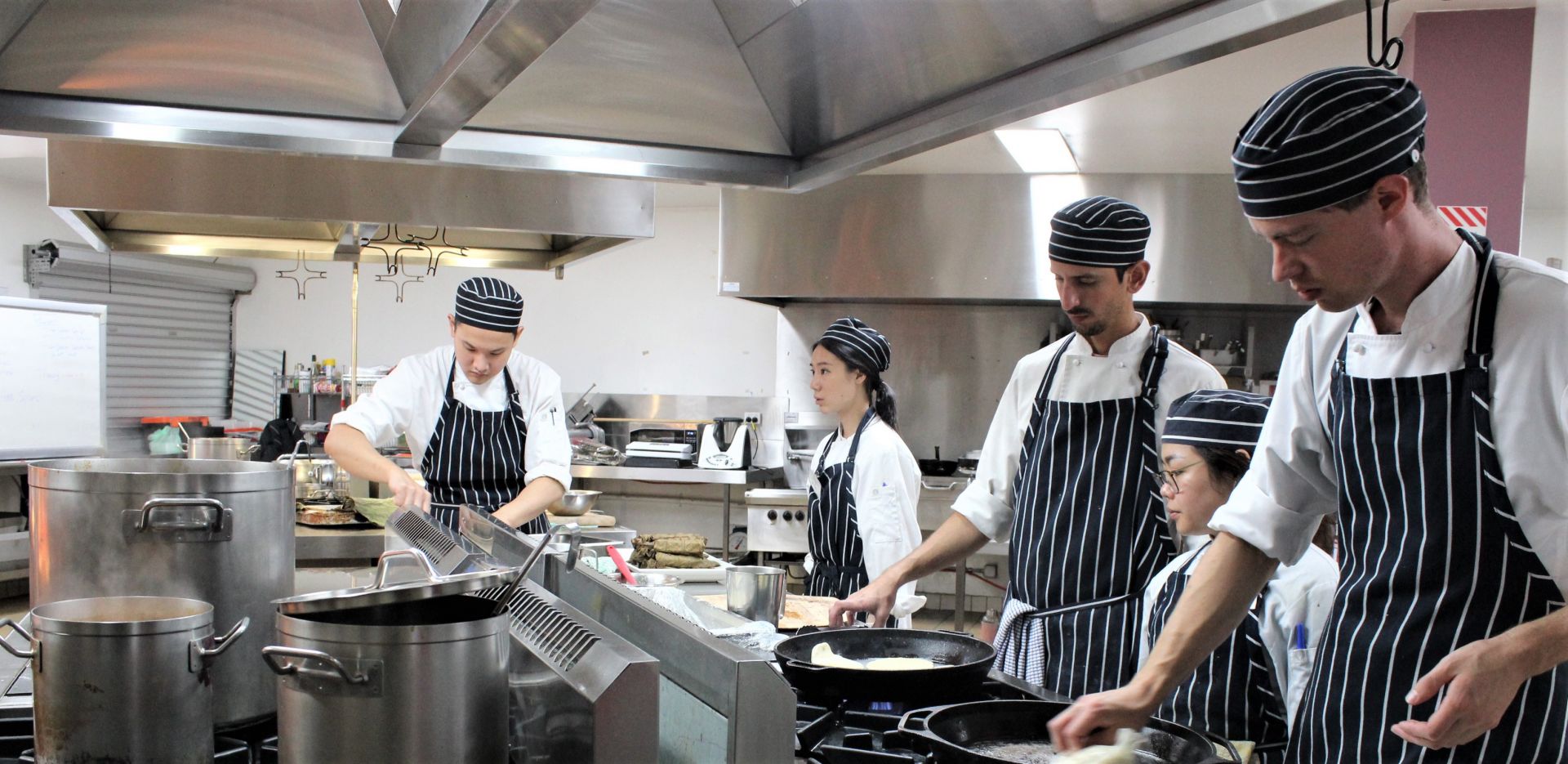 Students in the kitchen ready to take an order