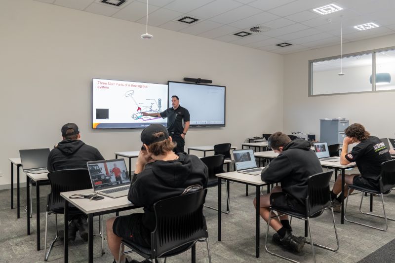 A TasTAFE Automotive Trainer delivering a lesson to learners in a classroom-based training session