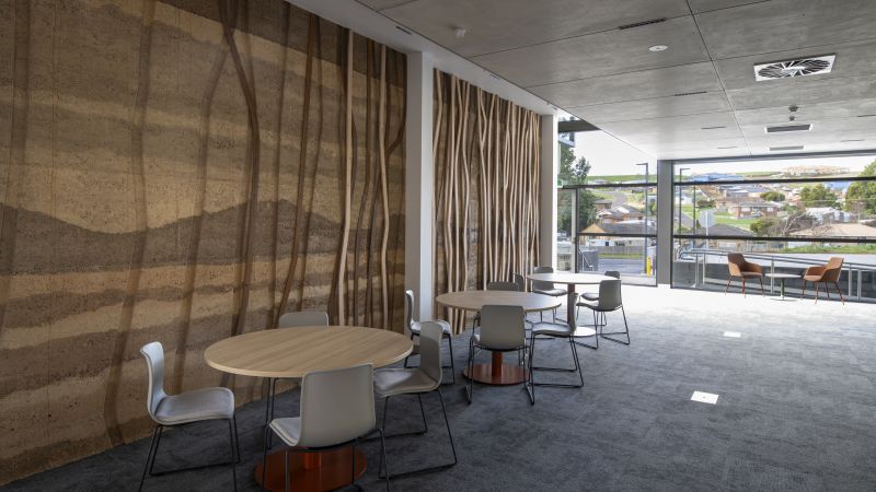 Ag centre room with tables and textured wooden wall