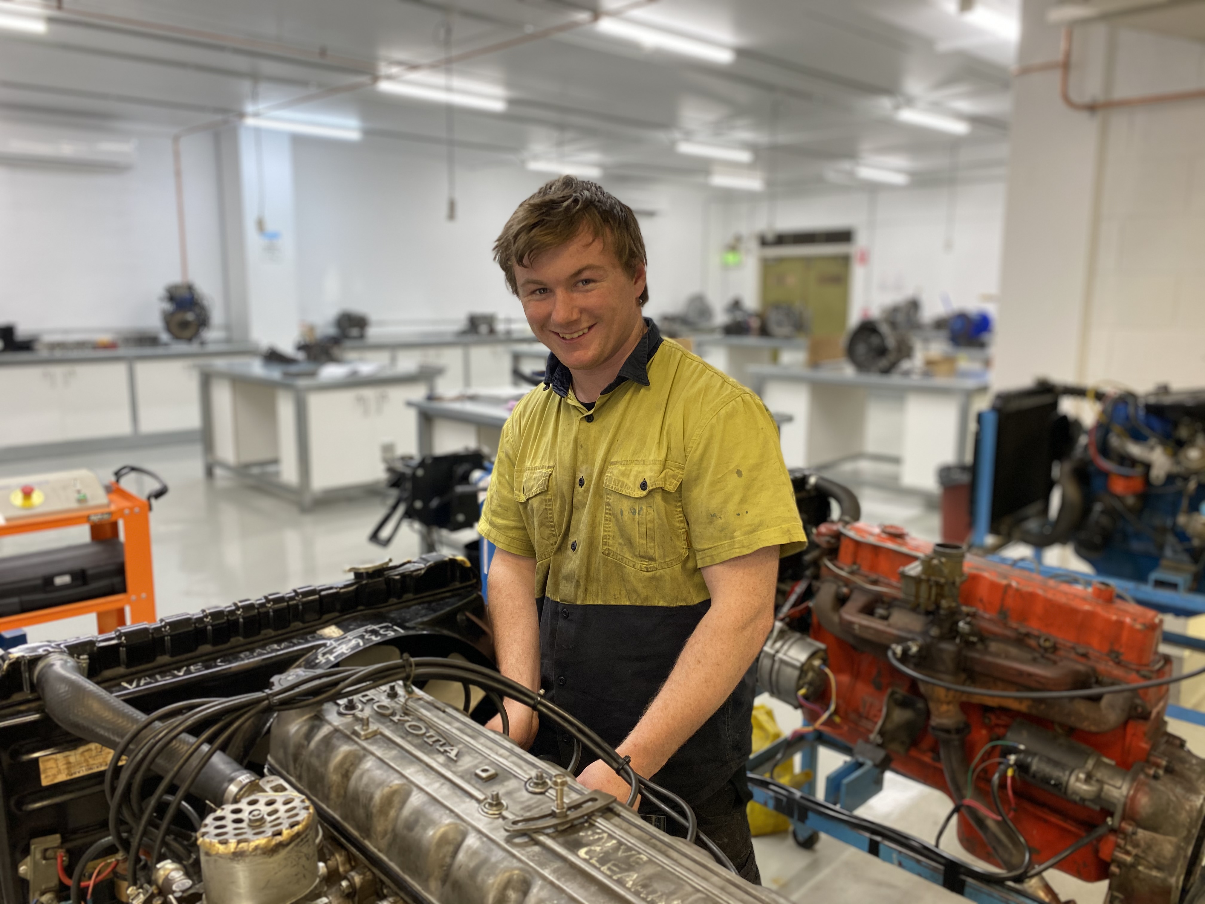 Apprentice working in an automotive workshop