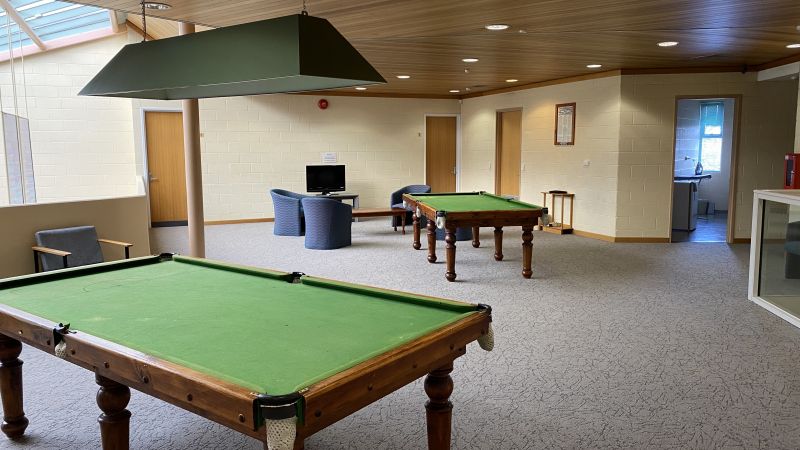 Recreation room with pool tables, a sitting area and television